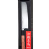 Samura Okinawa Nakiri Küchenmesser 172 mm braun schwarzer Griff - Messer liegt in halb transparenter Produktverpackung mit japanischen Schriftzügen drauf, auf einem weißen Hintergrund
